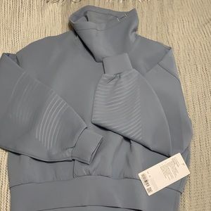 Lululemon Full Flourish Pullover. Brand new with tags, never worn size 10.